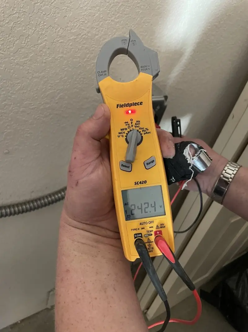 Voltage testing with clamp meter during Outlet Installation in Memphis